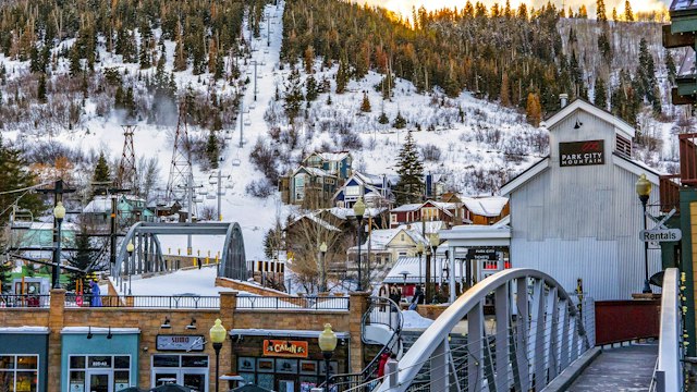 Park City with a snowy ski run on the mountain behind
