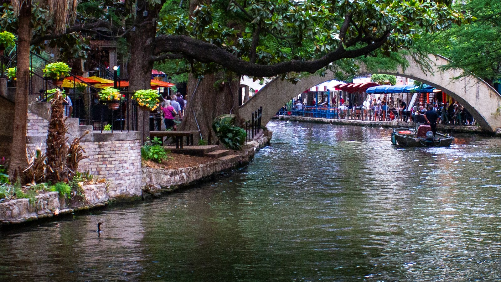 The San Antonio River Walk with a stone bridge