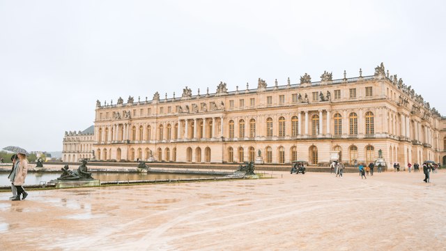 The Palace of Versailles and a fountain in spring